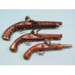 Three replica flintlock pistols, one with inlaid stock, latter 16in. Shipping arrangements