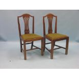 A set of four 19th century Hepplewhite mahogany dining chairs, with camel-backs and drop-in seats