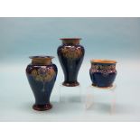 A pair of Royal Doulton glazed stoneware vases, baluster-shape with moulded Art Nouveau leafage