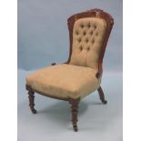 A Victorian walnut nursing chair, frame lightly carved with foliage, buttoned green brocade