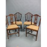 Two pairs of Hepplewhite-period mahogany dining chairs, camel-backs and matching upholstered seats