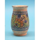 A Crown Ducal vase designed by Charlotte Rhead, bright, tube-lined floral design against an orange-