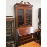 An Edwardian inlaid mahogany bureau bookcase, swan-neck pediment above a pair of astragal-glazed