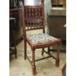 A set of five Lancashire-type spindle-back dining chairs, with drop-in seats, including carver,