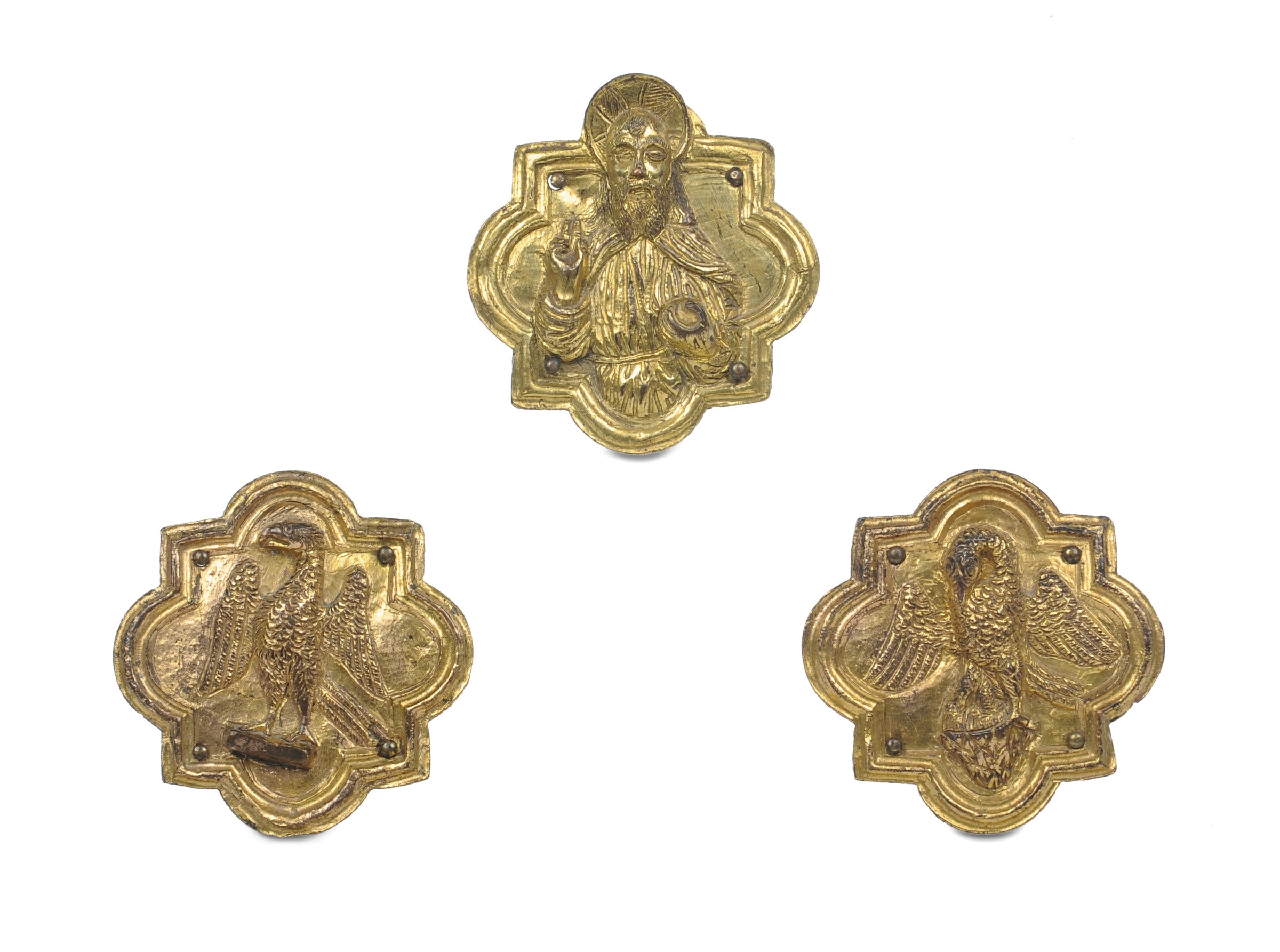 Italia del nord, XV secolo, Insieme di tre placche polilobate in bronzo fuso, cesellato e dorato con
