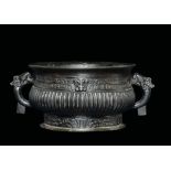 A bronze handeled censer with a geometric archaic style motif, China, Ming Dynasty, 17th century