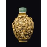 A porcelain snuff bottle with figures in relief, China, Qing Dynasty, 19th century h cm 8,2