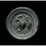 A bronze Bo Ju mirror with central boss, China, Han Dynasty (206 b.C-220 a.C.) cm 10,8