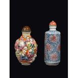Two different porcelain snuff bottles: one Famille-Rose with wise men in relief and one blue and