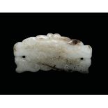 A white and russet jade belthook, China, Ming Dynasty, 16th century cm 3x6,6