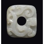 A white jade belthook with mythical animal in relief, China, Qing Dynasty, 18th century cm 6