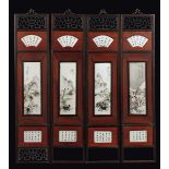A four-shutters screen with polychrome enamelled porcelain plaques depicting landscapes and