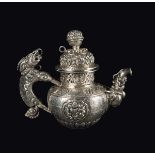 A small embossed silver teapot, Tibet, 19th century h cm 13