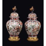 A group made by a pair and a single Imari porcelain potiches and cover on gilt bronze bases,