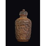 A large stained ivory snuff bottle with Guanyin within reserves, China, Qing Dynasty, 19th century h