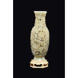 A rare white and russet fretworked jade vase, China, Qing Dynasty, Jiaqing Period (1727-1820) h cm