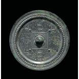 A bronze Bo Ju mirror with central boss, China, Han Dynasty (206 b.C-220 a.C.) cm 13