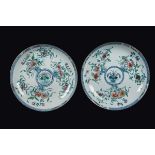 A pair of polychrome enamelled porcelain dishes with floral deocration, China, Qing Dynasty,