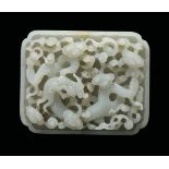 A white jade plaque with dragon in relief, China, Qing Dynasty, Qianlong Period (1736-1795) cm 7,