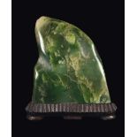 A green jade schoolar rock, China, Qing Dynasty, 19th century h cm 19