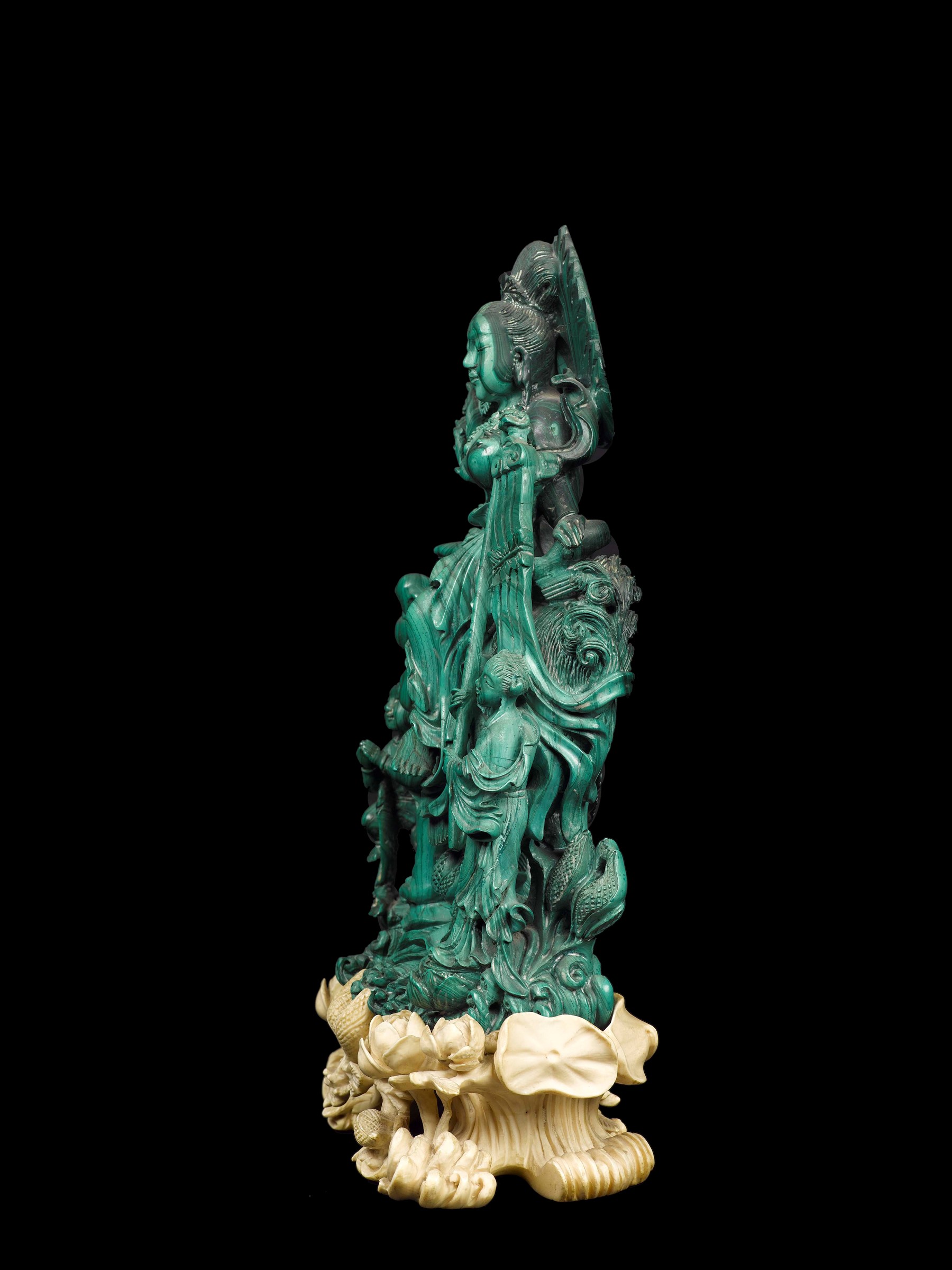 A finely carved malachite group with Guanyin on a Pho dog and children with carved ivory stand, - Image 3 of 3