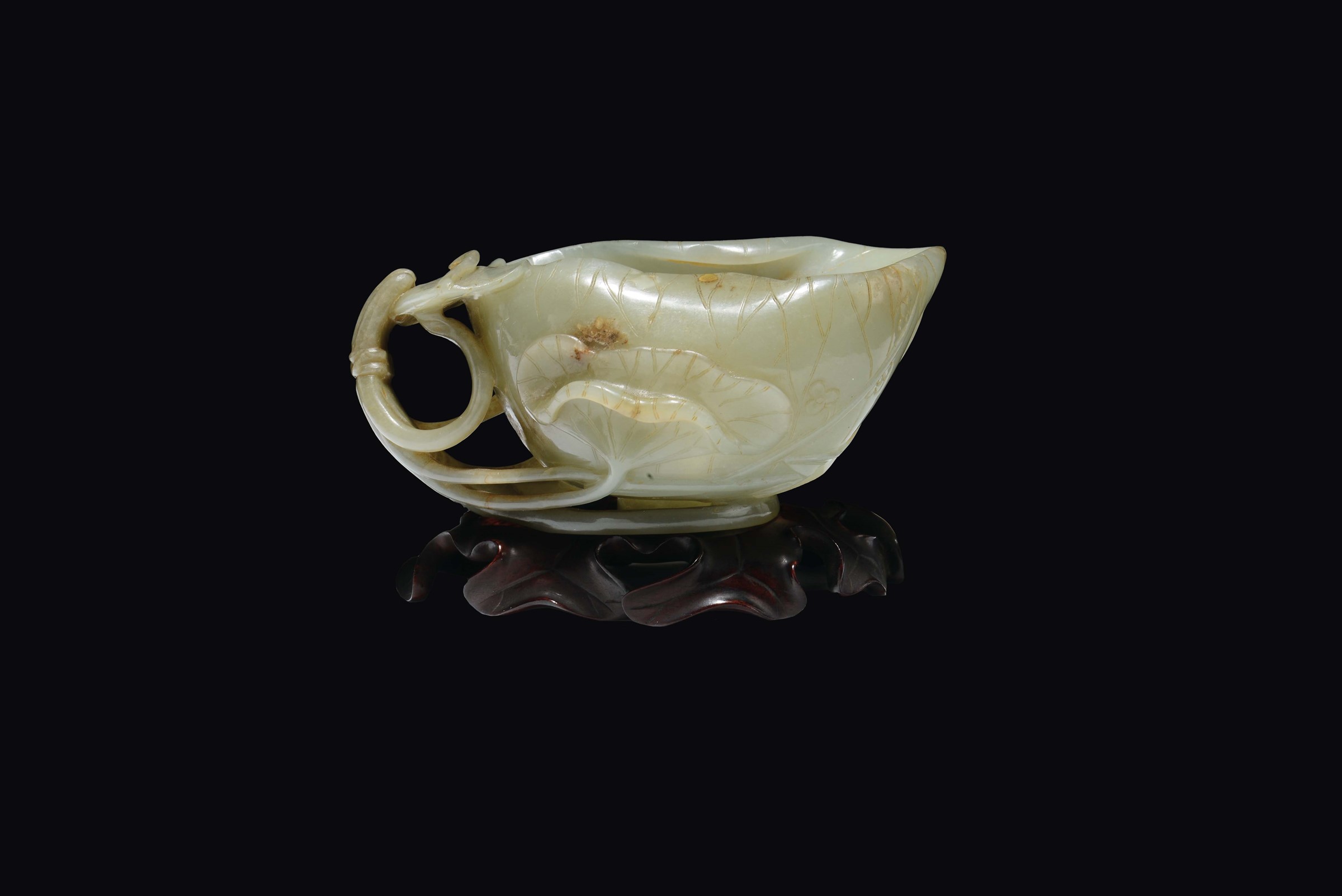 A Celadon white and russet jade "flower and branch" cup, China, Qing Dynasty, Qianlong Period (