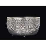 An embossed silver bowl with dancing figures, India, 19th century cm 14x23,5