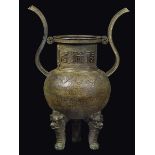 A large bronze censer with handles with a geometric archaic style motif and six-character