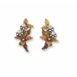 A pair of gold and pearl earrings. Buccellati montatura in oro giallo 750/1000 ed argento
