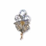 A pearl, gold and silver brooch. Buccellati montatura in oro ed argento con rosette di diamante