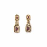 Bulgari. A ruby and diamond earrings montatura in oro giallo 750/1000