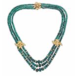 An emerald, gold and diamond necklace fermezza ed inserti in oro giallo 750/1000