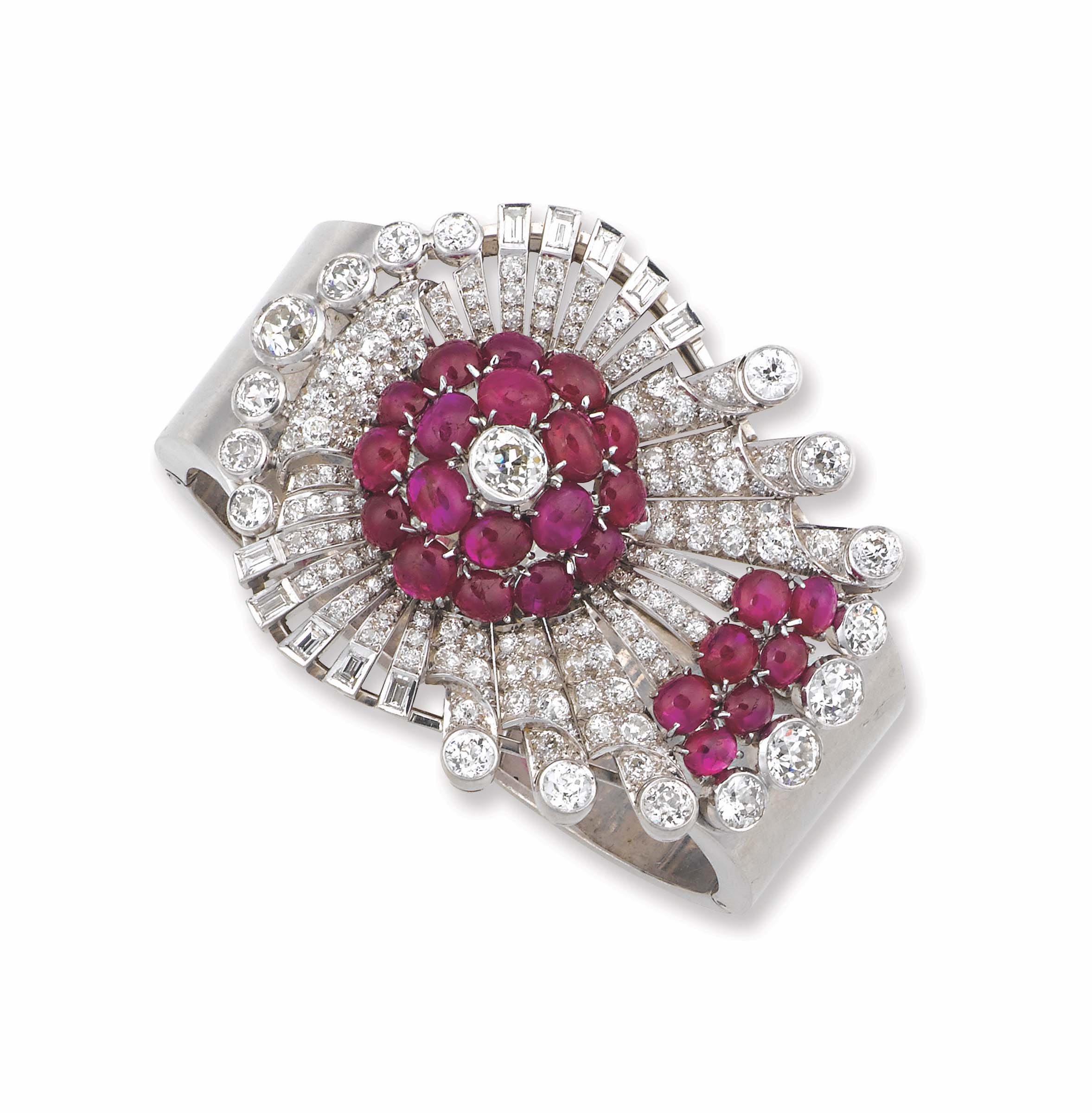 An Art Deco platinum, ruby and diamond bangle montatura in platino