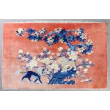 A Chinese "Picture" rug woven in pastel shades of blues and browns with two kylin under a