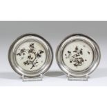 A pair of late Victorian silver circular coasters, each inset with shibayama panels inlaid with