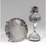 A George V silver circular salver with shaped and moulded rim on four scroll and pad feet, 8.