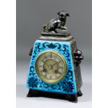 A late 19th Century French pottery cased mantel clock, No. 23478, the 3.25ins diameter silvered