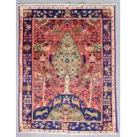 A modern Persian rug of Tabriz pattern, woven in colours with a centre tree, the field filled with
