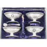 A set of four late Victorian silver oval salts of Neo-classical design with bead mounts, pierced