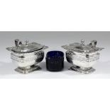 A pair of George III silver rectangular mustard pots, the domed covers with acorn pattern finials,