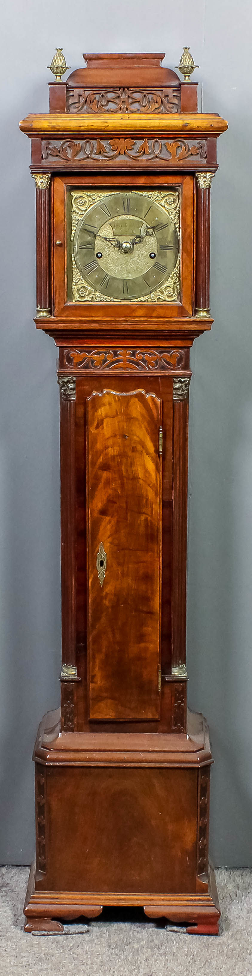 A walnut cased "Granddaughter" longcase clock, the 7ins square brass dial with chapter ring with