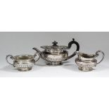 A George IV and William IV silver Harlequin three piece tea service of circular squat form with