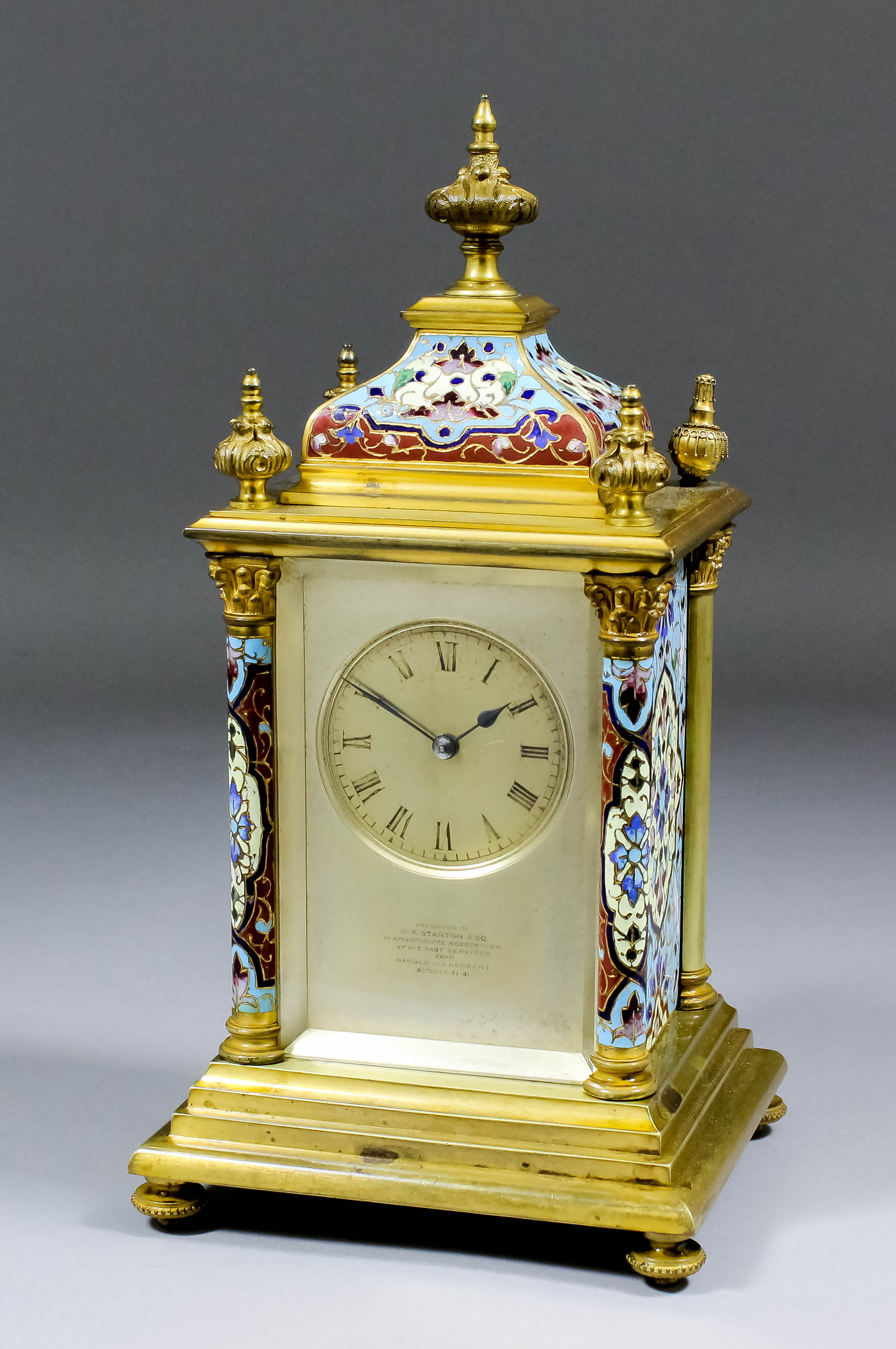 A late 19th/early 20th Century French gilt brass and champleve enamel cased mantel clock by E.M. &