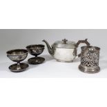 A George VI silver rectangular teapot of panelled form with fan and bead mounts an angular wood