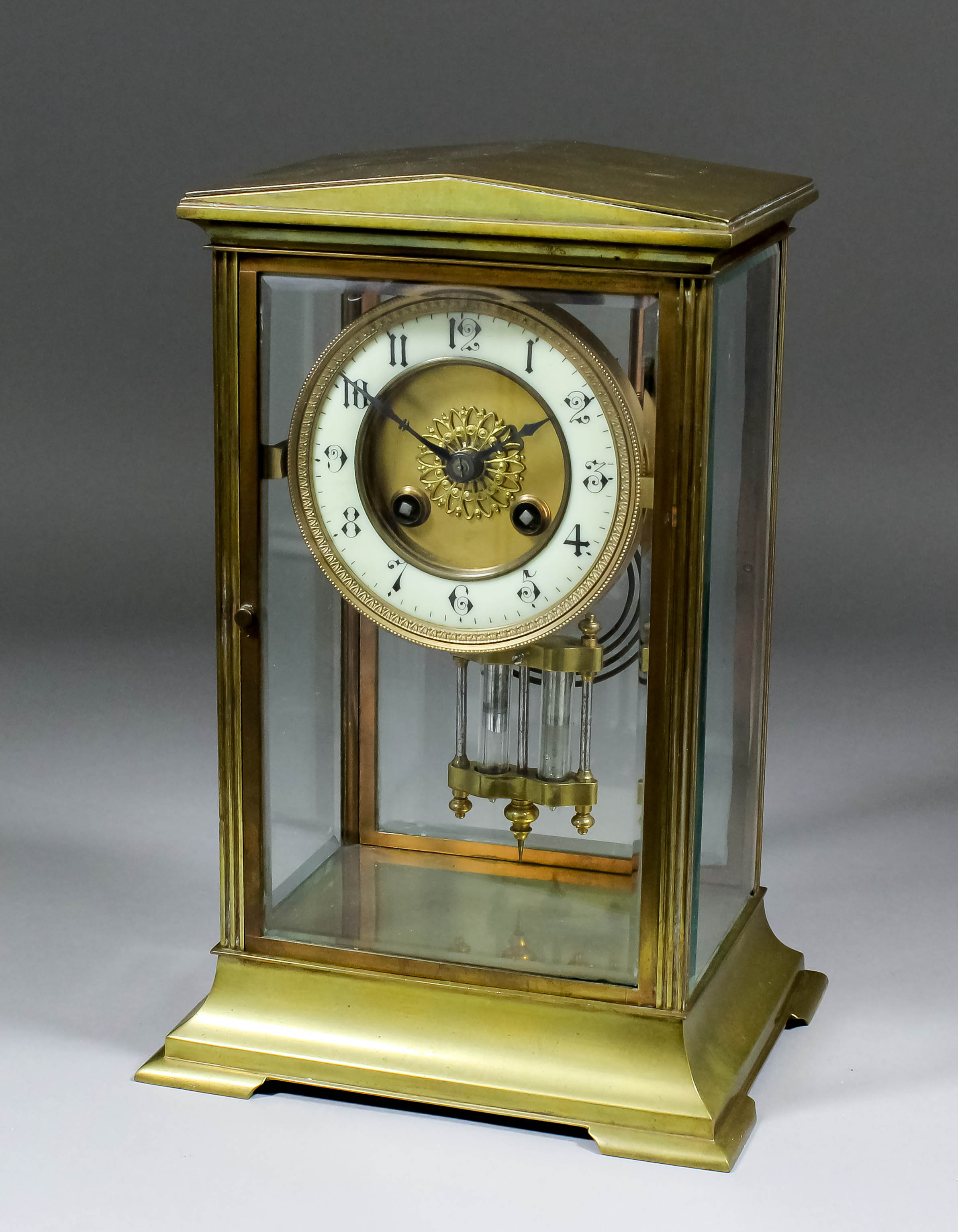 A 19th Century French gilt brass cased "Four Glass" mantel clock, the 4.75ins diameter enamelled