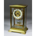 A 19th Century French gilt brass cased "Four Glass" mantel clock, the 4.75ins diameter enamelled