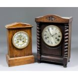 A late 19th Century French oak cased mantel clock, the 3.75ins diameter white enamelled chapter ring