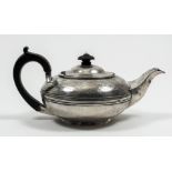 A George IV bachelor's silver squat teapot, the body with moulded girdle and engraved with two