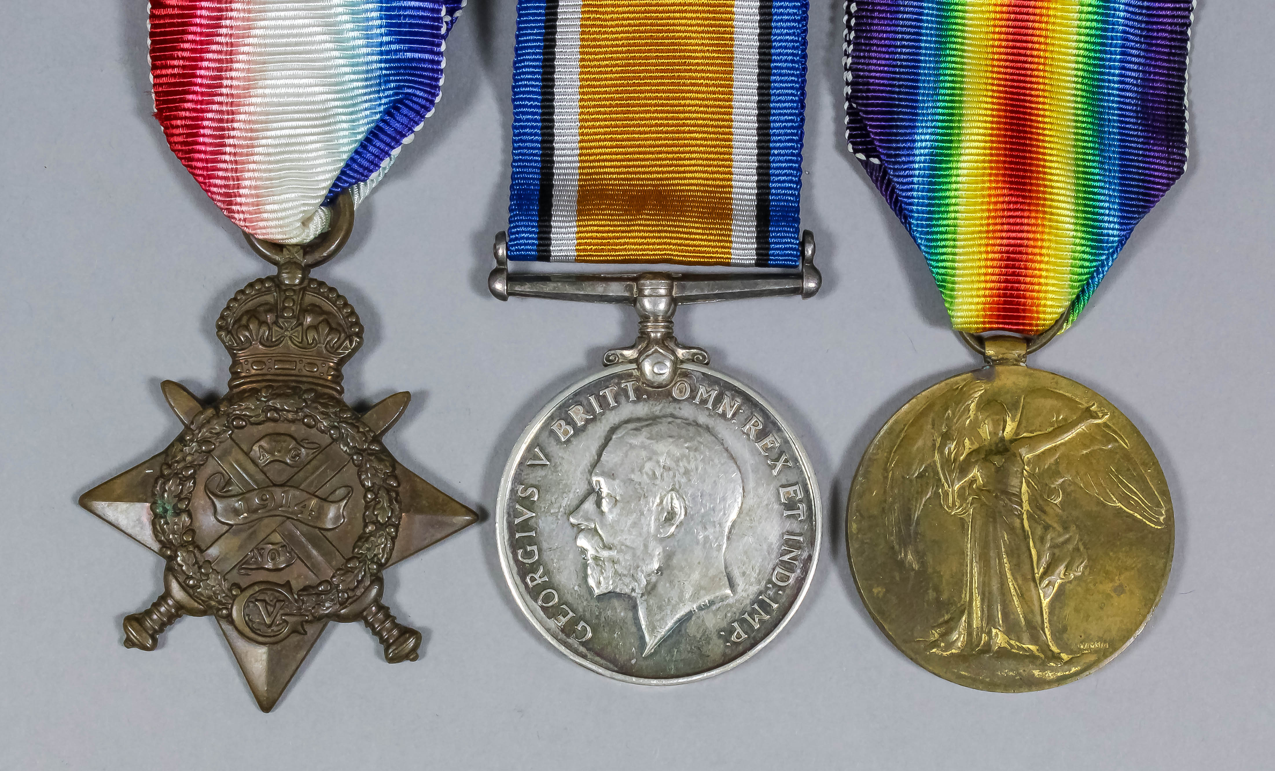 A group of three George V First World War medals comprising - 1914 Star, 1914-18 War Medal,