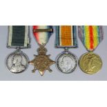 A group of four George V First World War medals comprising, 1914 Star with Mons clasp, British War